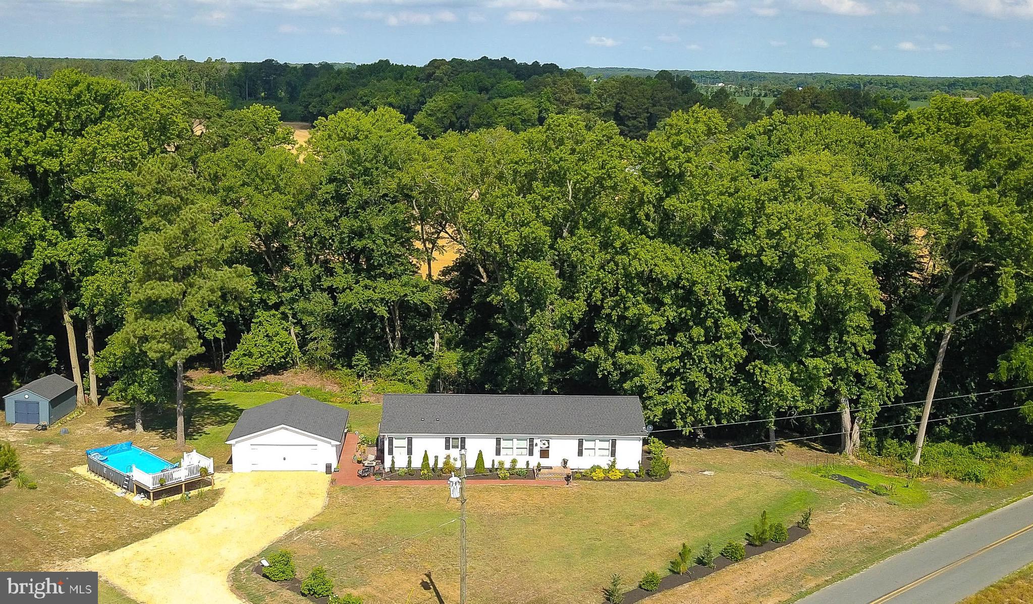 5520 Indiantown Road Rhodesdale, MD 21659 - Photo 1 of 51 a view of a swimming pool with a yard