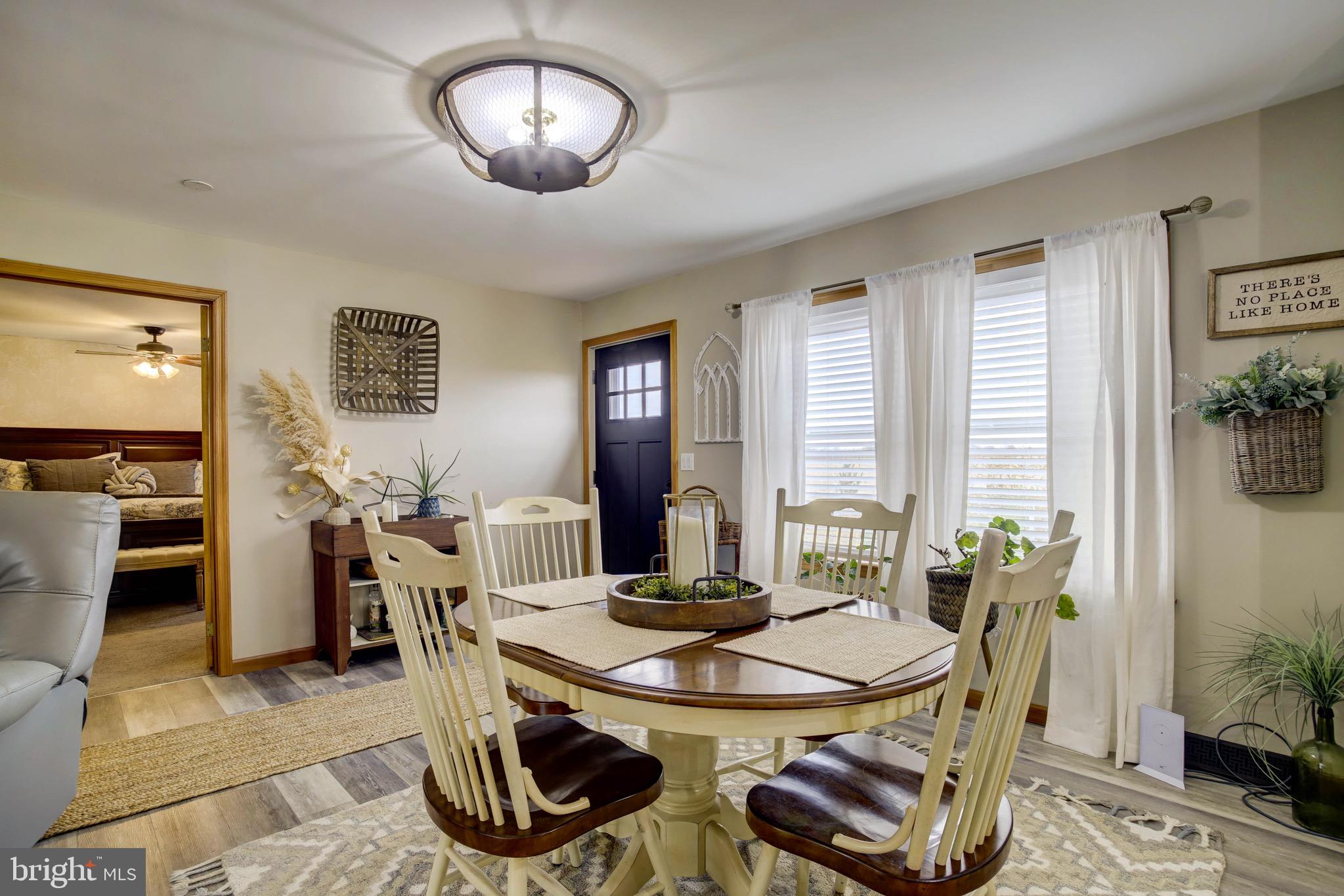 5520 Indiantown Road Rhodesdale, MD 21659 - Photo 11 of 51 a view of a dining room with furniture window and wooden floor