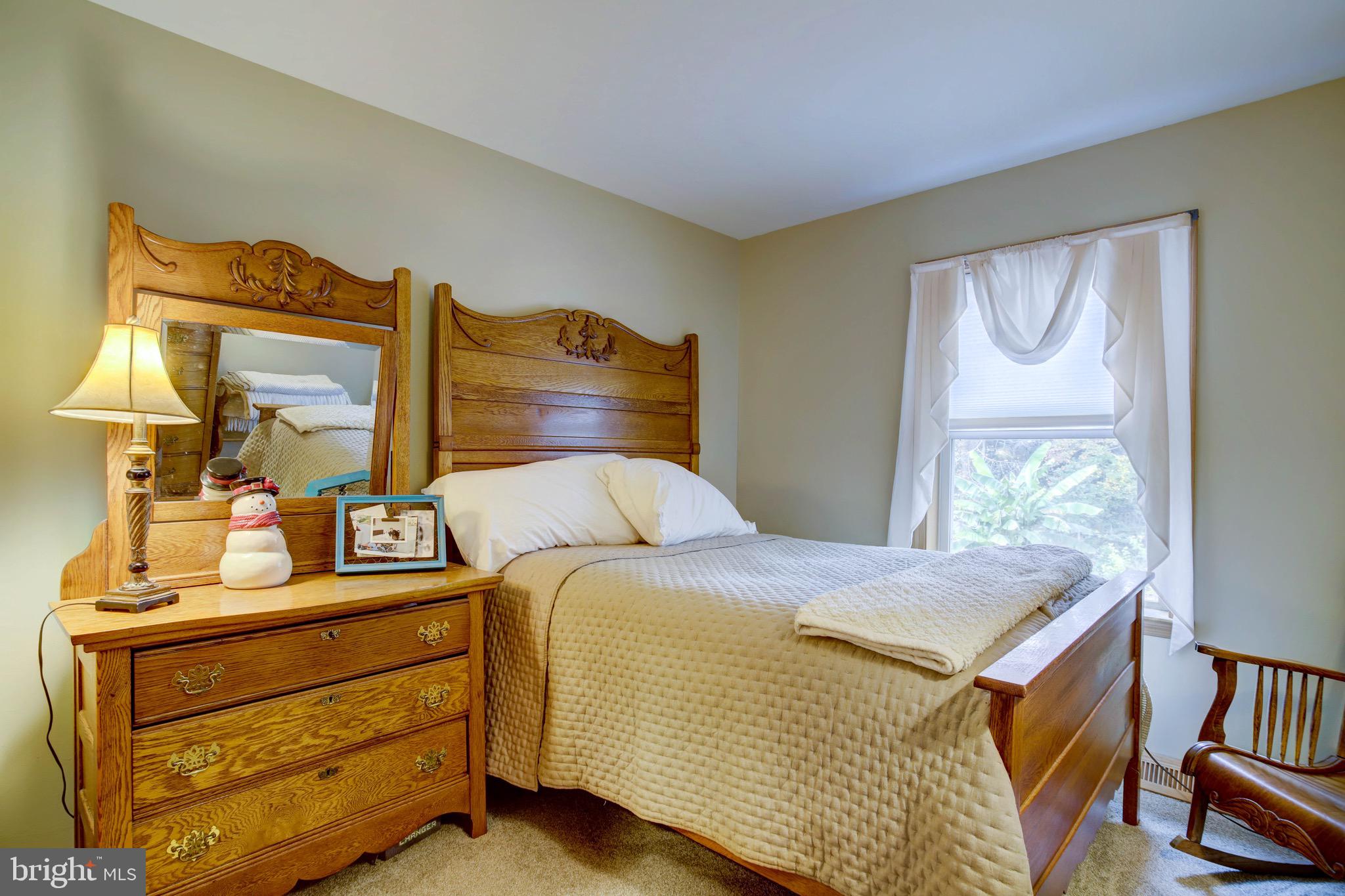 5520 Indiantown Road Rhodesdale, MD 21659 - Photo 26 of 51 a bedroom with a bed and wooden floor