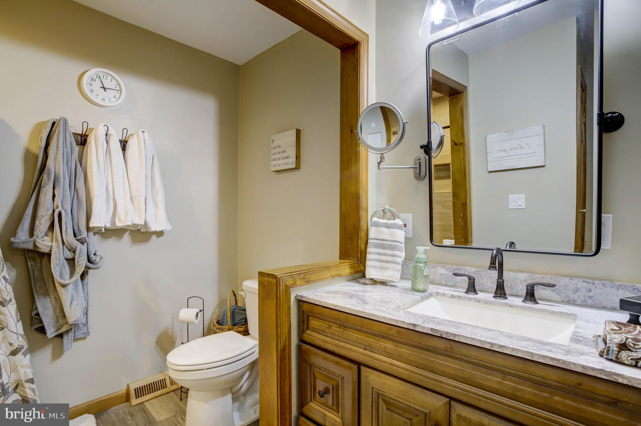5520 Indiantown Road Rhodesdale, MD 21659 - Photo 39 of 51 a bathroom with a granite countertop sink and a mirror