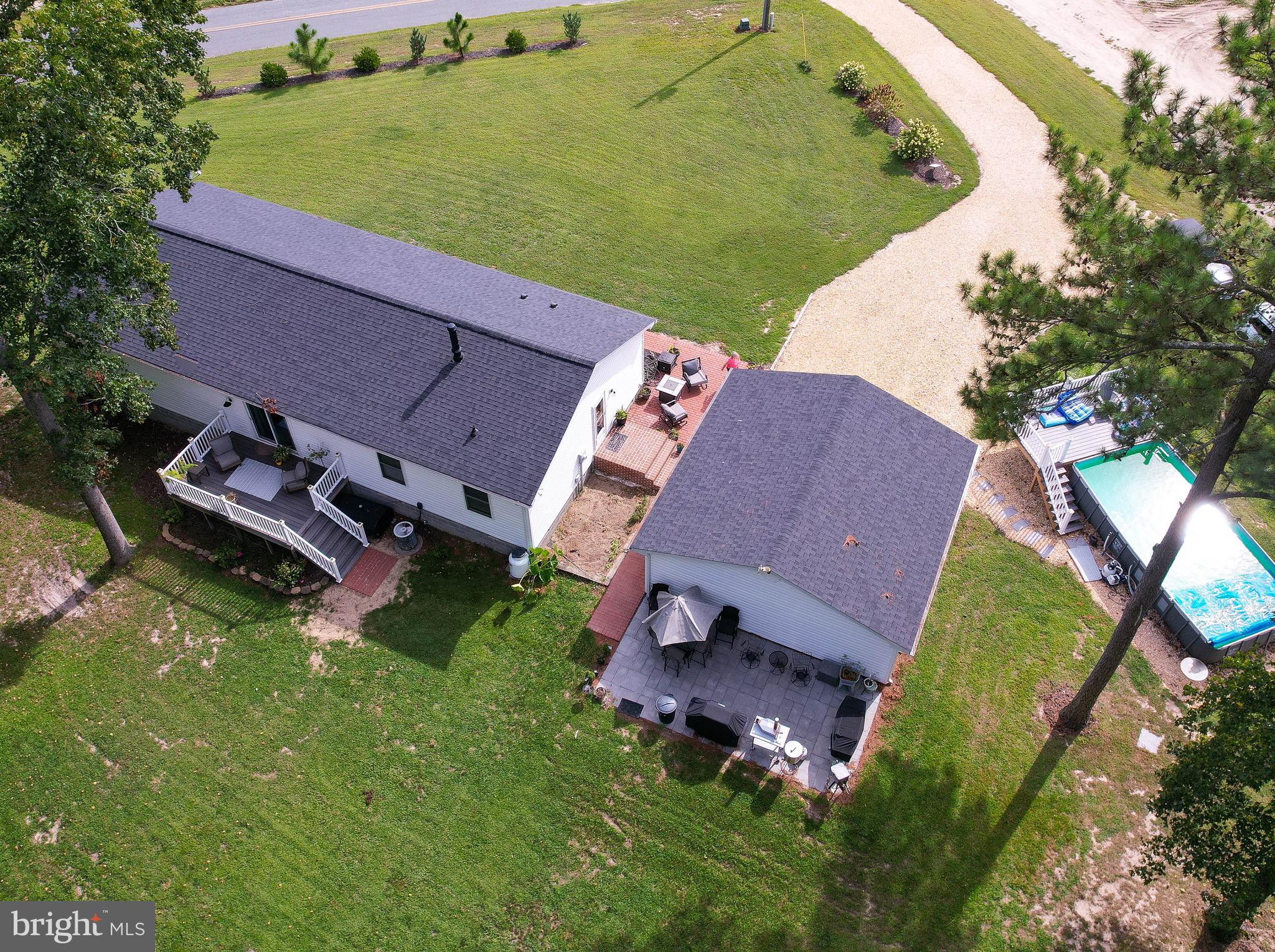 5520 Indiantown Road Rhodesdale, MD 21659 - Photo 49 of 51 an aerial view of a house with a garden and swimming pool