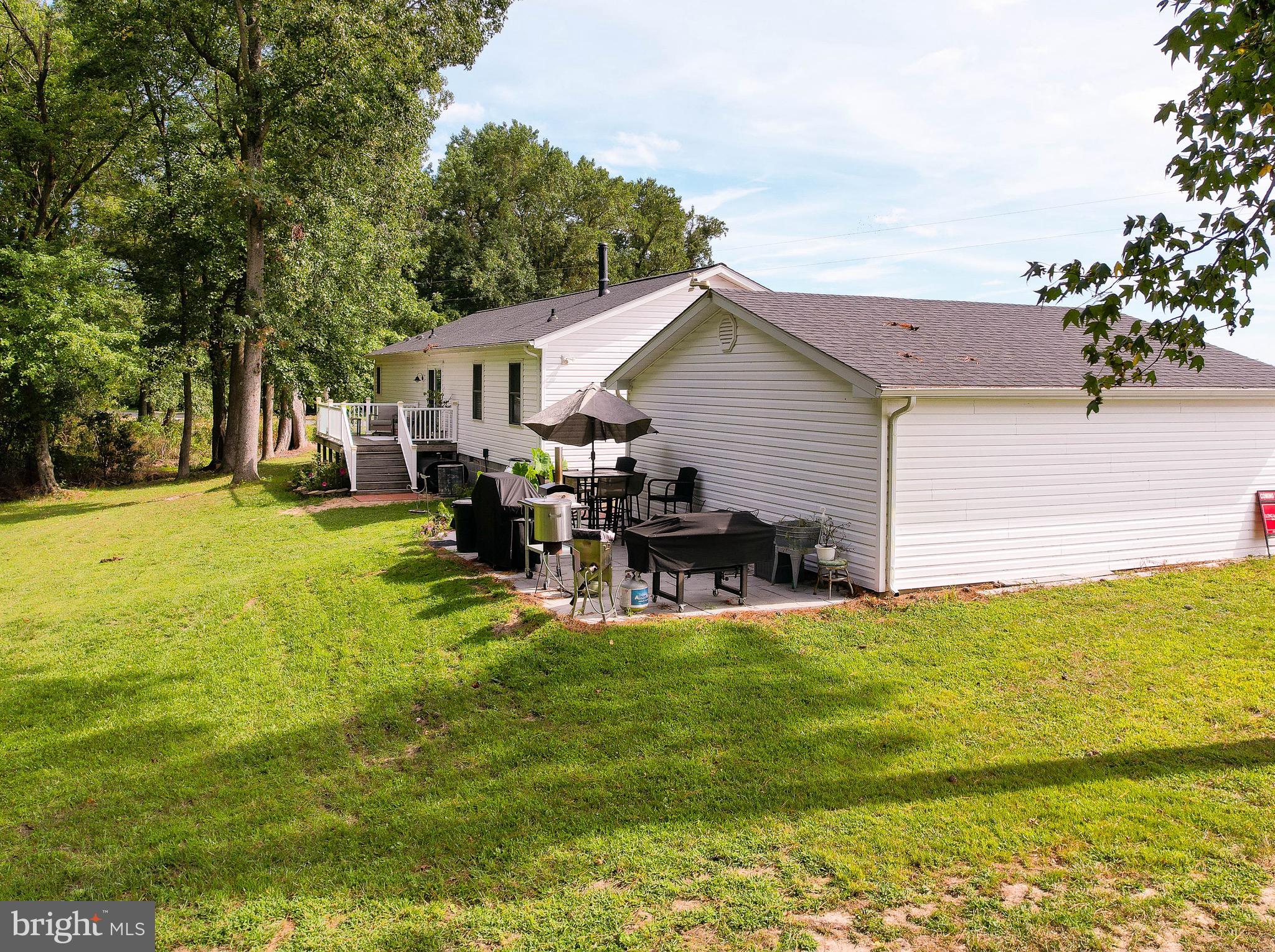 5520 Indiantown Road Rhodesdale, MD 21659 - Photo 50 of 51 a view of a house with a yard patio and fire pit