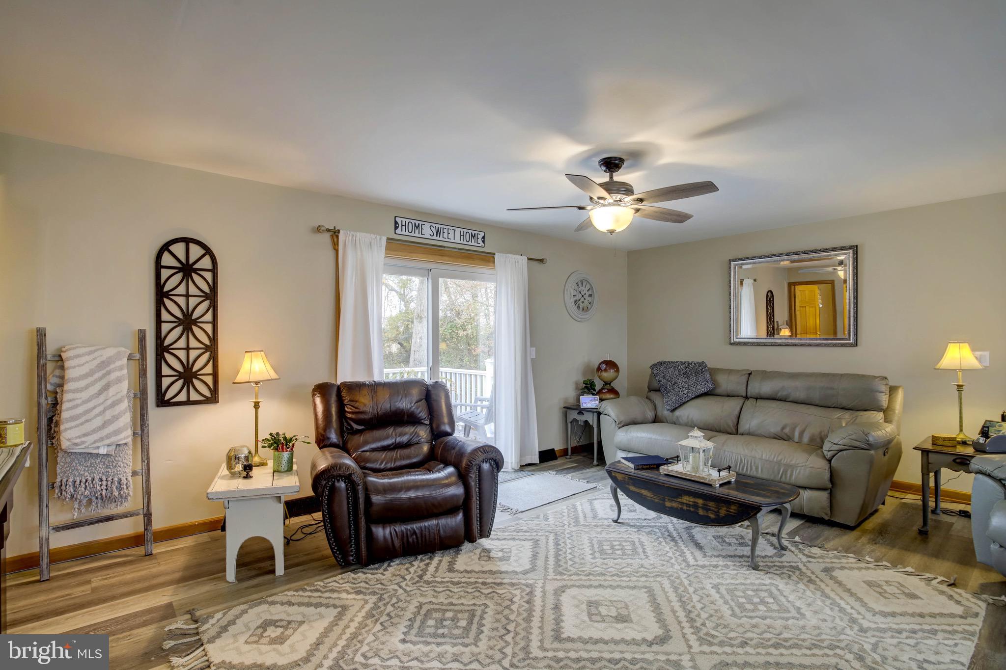 5520 Indiantown Road Rhodesdale, MD 21659 - Photo 5 of 51 a living room with furniture and a ceiling fan