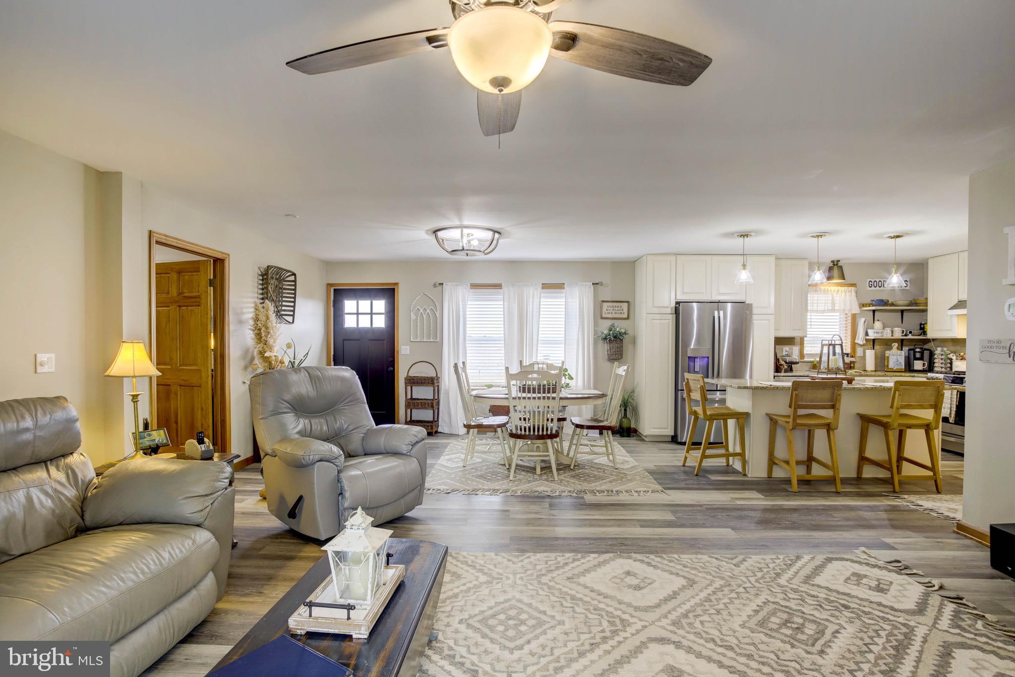 5520 Indiantown Road Rhodesdale, MD 21659 - Photo 7 of 51 a living room with furniture kitchen view and a chandelier