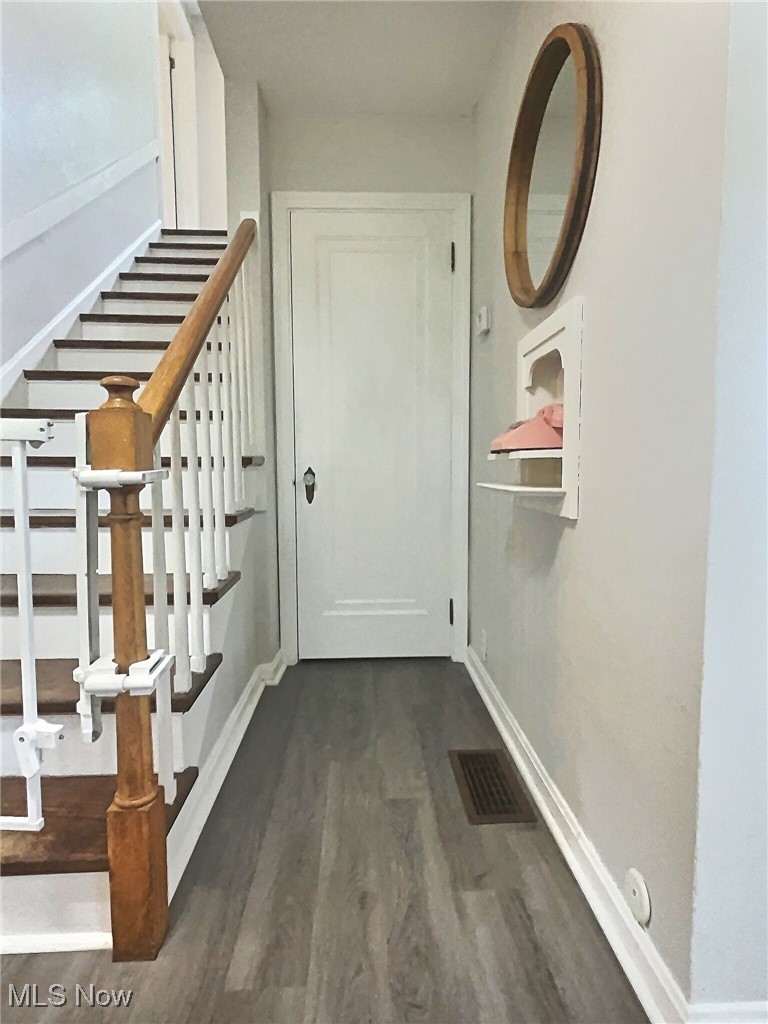 3688 Easton Road Norton, OH 44203 - Photo 11 of 37 Staircase featuring dark hardwood / wood-style floors