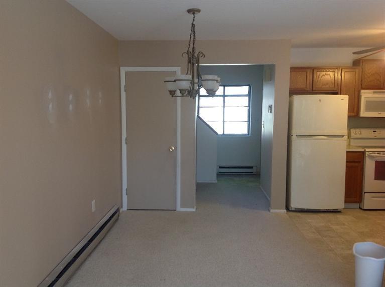 11 Round House Road, Unit 11 Bourne, MA 02532 - Photo 23 of 23 a view of a kitchen with a refrigerator a sink dishwasher and a refrigerator
