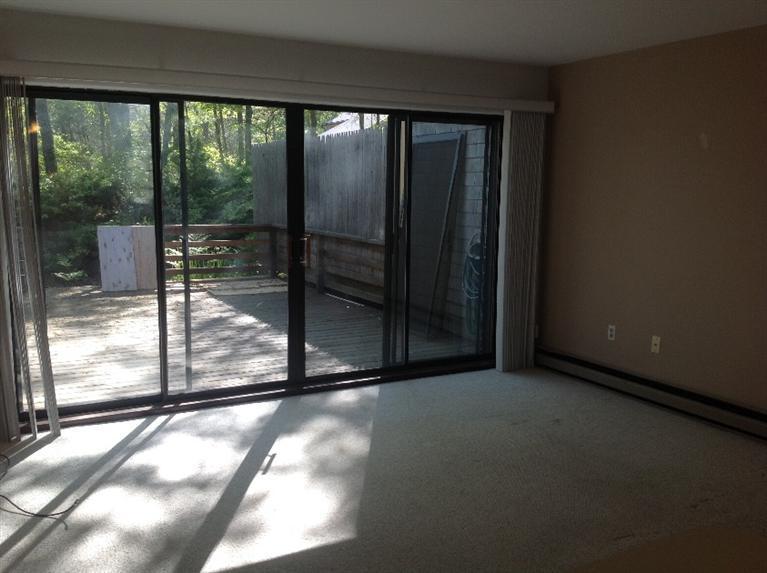 11 Round House Road, Unit 11 Bourne, MA 02532 - Photo 7 of 23 a view of a room with sliding glass door
