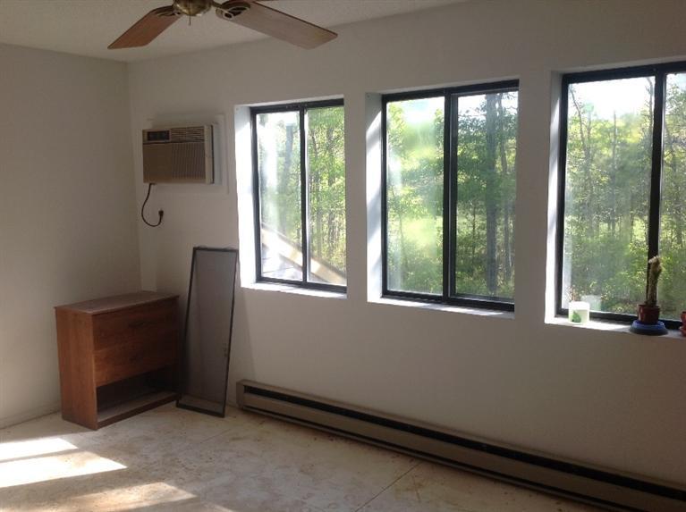 11 Round House Road, Unit 11 Bourne, MA 02532 - Photo 10 of 23 a view of an empty room with a window
