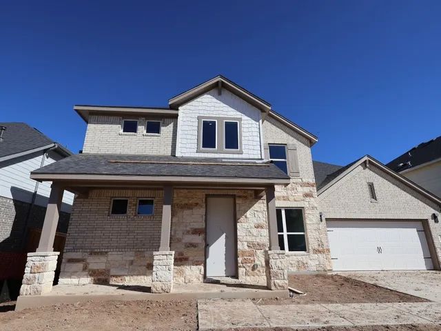 a front view of a house with yard