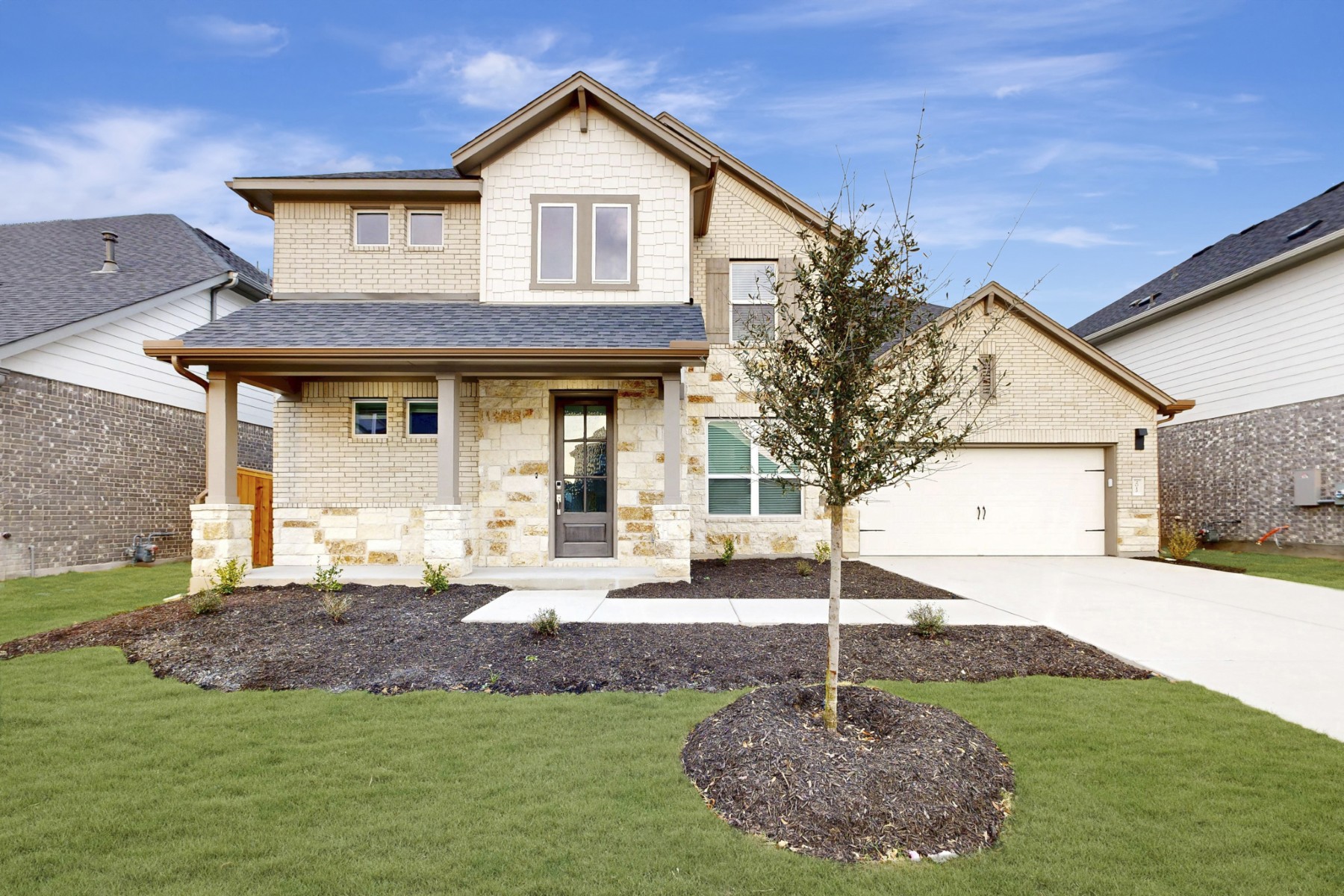 a front view of a house with a yard