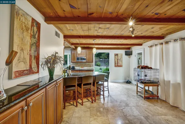a dining room with furniture and window