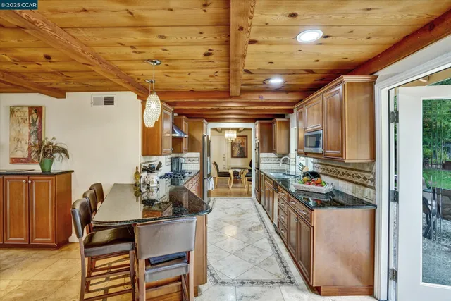 a kitchen with a stove and a refrigerator