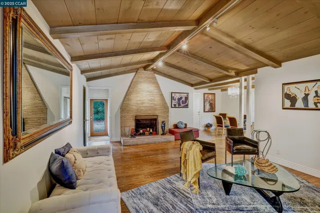 a living room with furniture or fireplace and a table