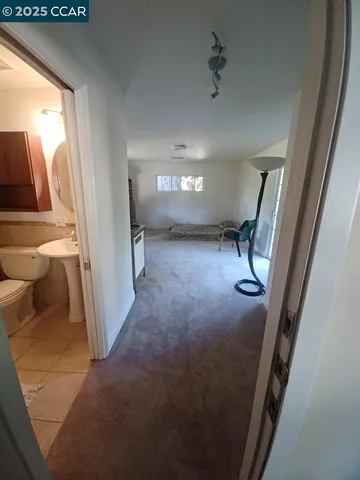 a view of a hallway with a livingroom