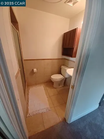 a bathroom with a toilet and a sink