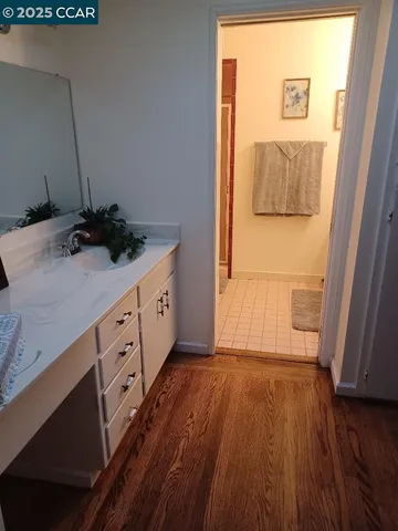 a bathroom with a sink and mirror
