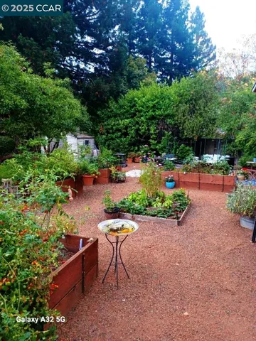 a backyard of a house with a yard and outdoor seating