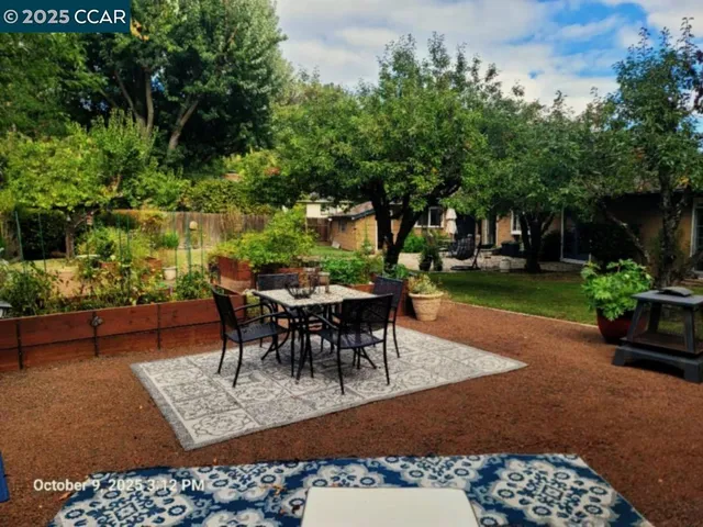 a view of a tables and chairs in patio