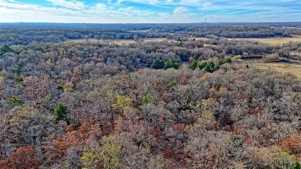 an aerial view of house with yard