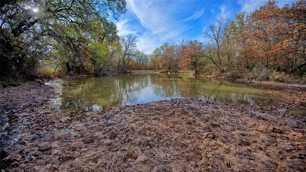 0 Carminati Road Montague, TX 76251 - Photo 24 of 39 a view of a lake with a big yard