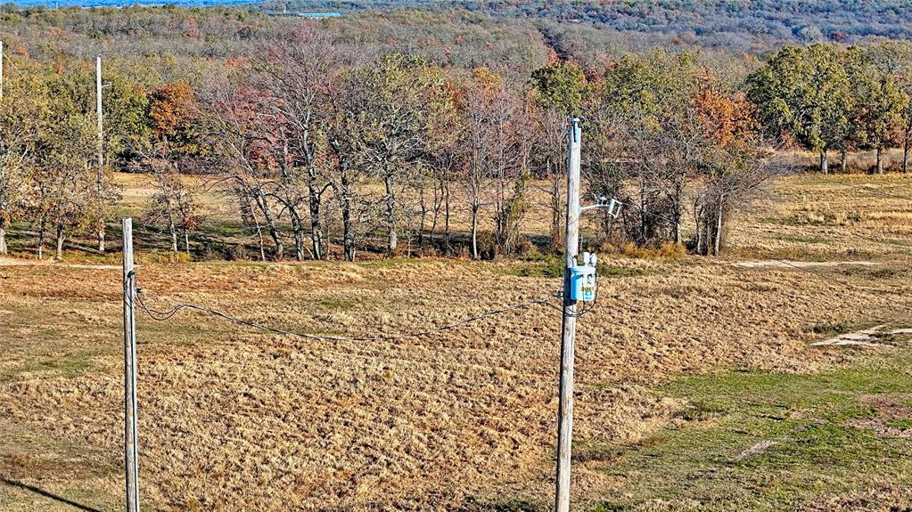 0 Carminati Road Montague, TX 76251 - Photo 32 of 39 a street sign under a large tree