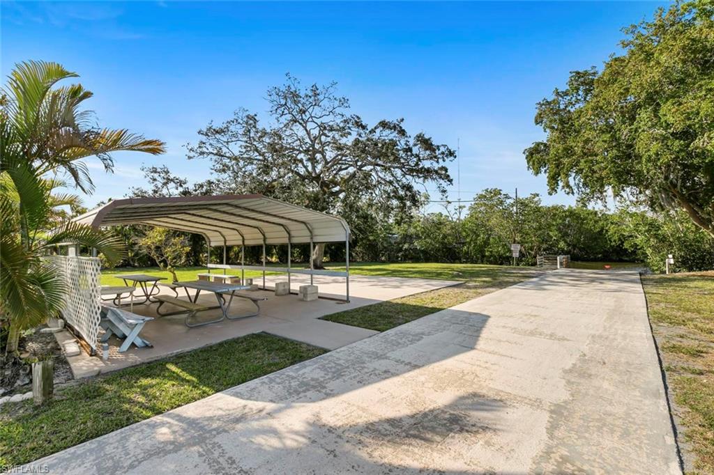 209 Rookery Road Naples, FL 34114 - Photo 28 of 41 Picnic area by water