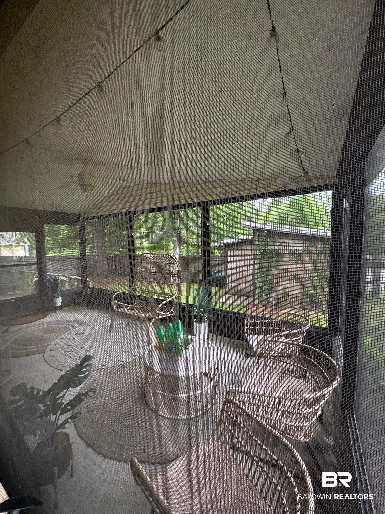 1434 Ridgewood Drive Lillian, AL 36549 - Photo 21 of 45 Sunroom with a ceiling fan and healthy amount of natural light
