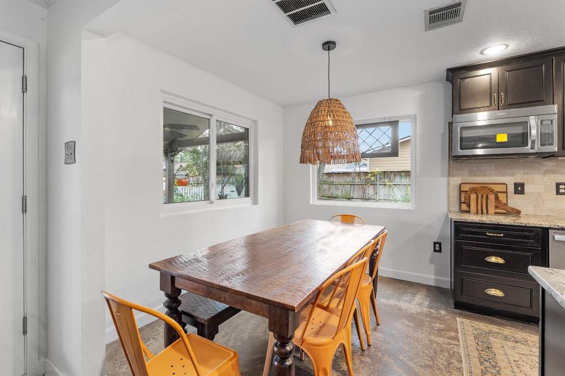 1808 Chincoteague Way Round Rock, TX 78681 - Photo 15 of 40 a view of a dining room with furniture and window