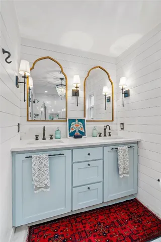 a bathroom with a glass shower door