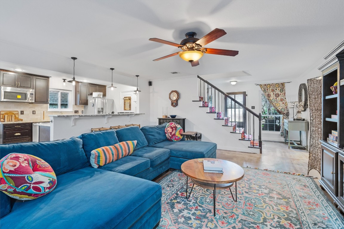 1808 Chincoteague Way Round Rock, TX 78681 - Photo 2 of 40 a living room with furniture and a chandelier