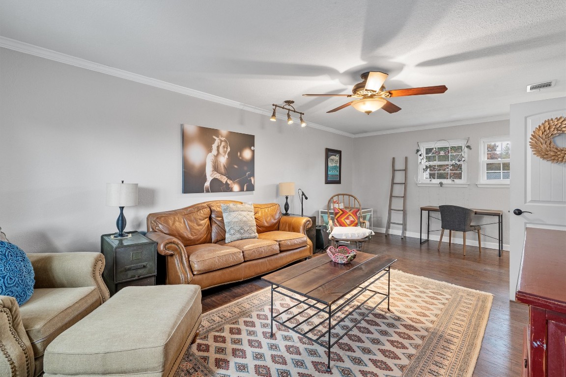 1808 Chincoteague Way Round Rock, TX 78681 - Photo 25 of 40 a living room with furniture two wooden floor and a ceiling fan
