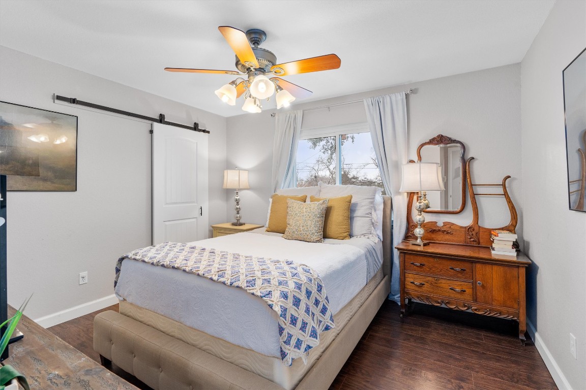 1808 Chincoteague Way Round Rock, TX 78681 - Photo 30 of 40 a bedroom with a bed and a chandelier