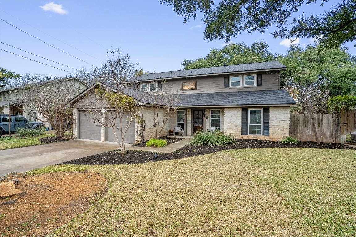 1808 Chincoteague Way Round Rock, TX 78681 - Photo 3 of 40 a front view of a house with garden