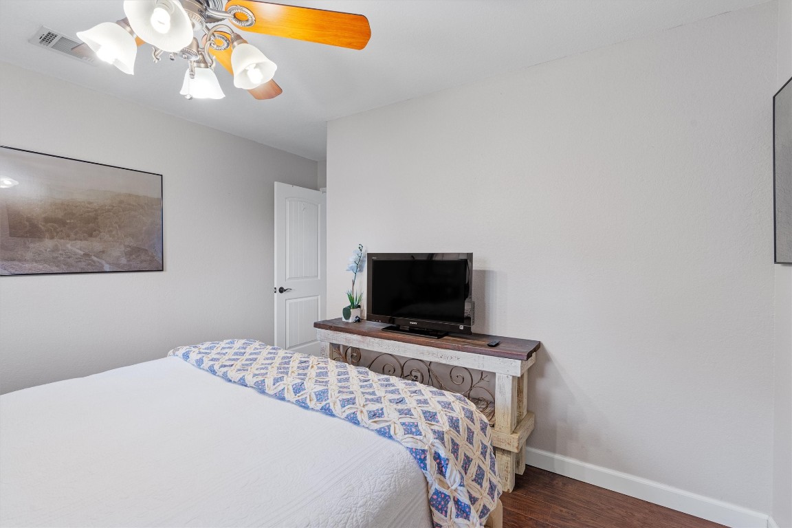 1808 Chincoteague Way Round Rock, TX 78681 - Photo 31 of 40 a bedroom with a bed and a flat screen tv
