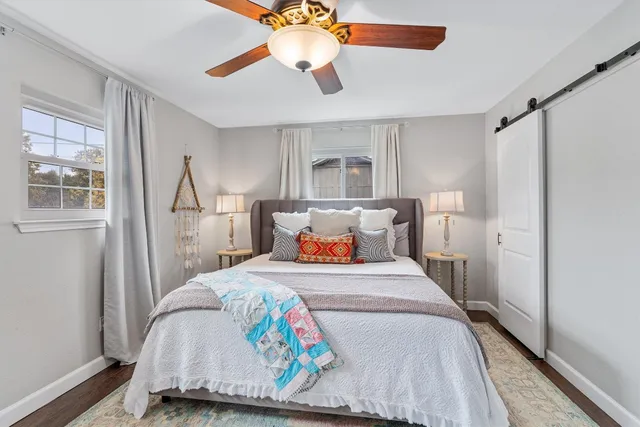 a bedroom with furniture and a window