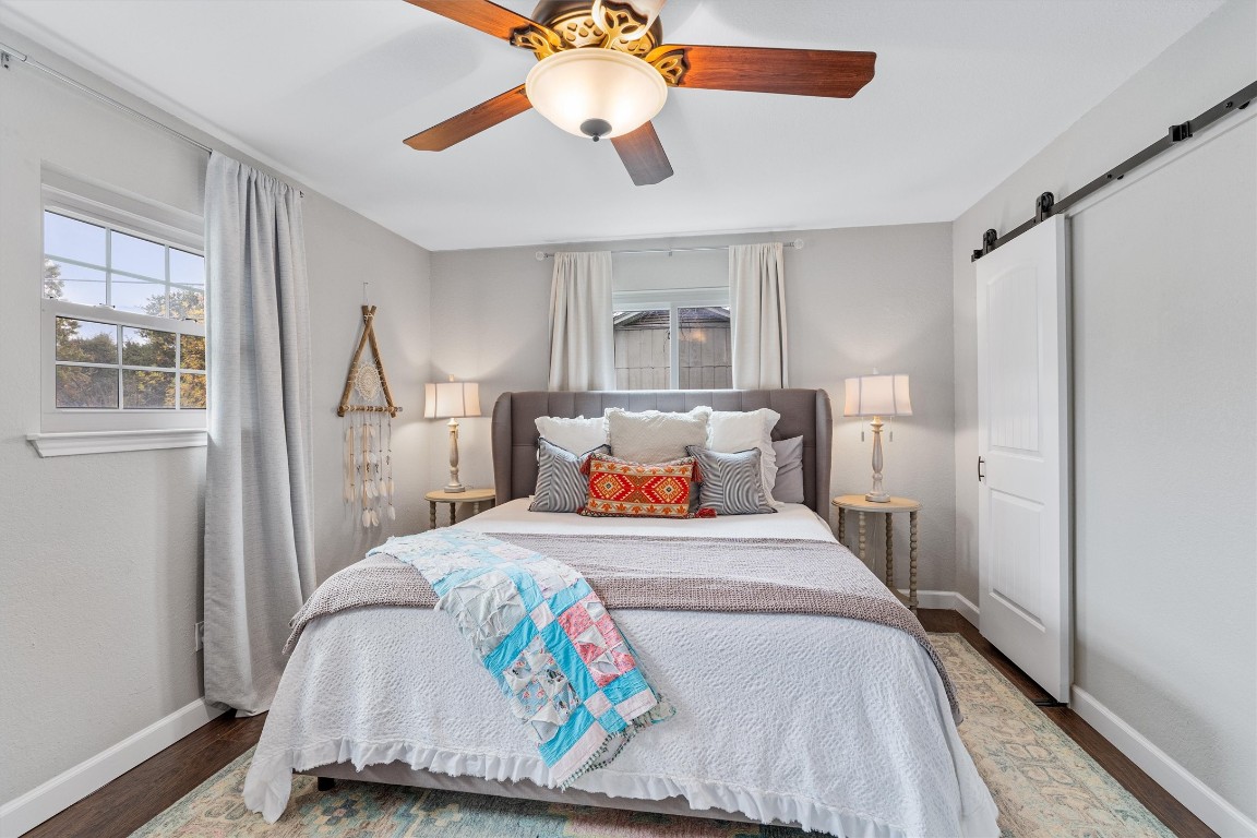 1808 Chincoteague Way Round Rock, TX 78681 - Photo 32 of 40 a bedroom with a bed and a chandelier