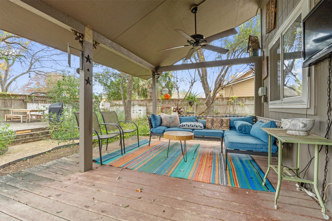 1808 Chincoteague Way Round Rock, TX 78681 - Photo 34 of 40 a living room filled with furniture and a floor to ceiling window