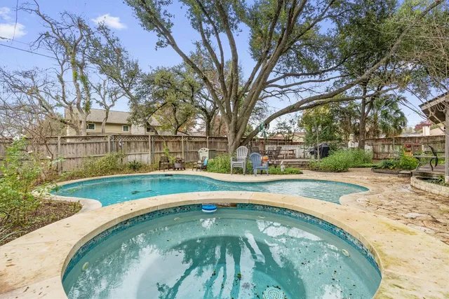 a view of swimming pool with outdoor seating