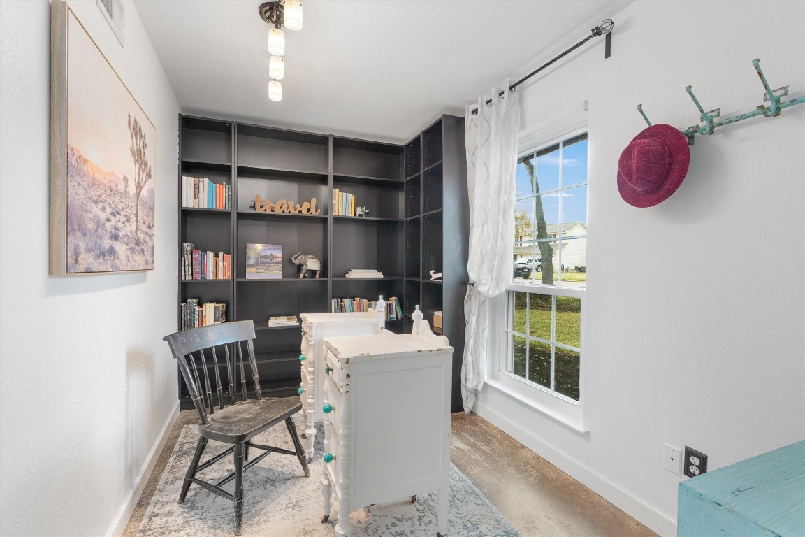 1808 Chincoteague Way Round Rock, TX 78681 - Photo 5 of 40 a kitchen with a refrigerator and a dining table
