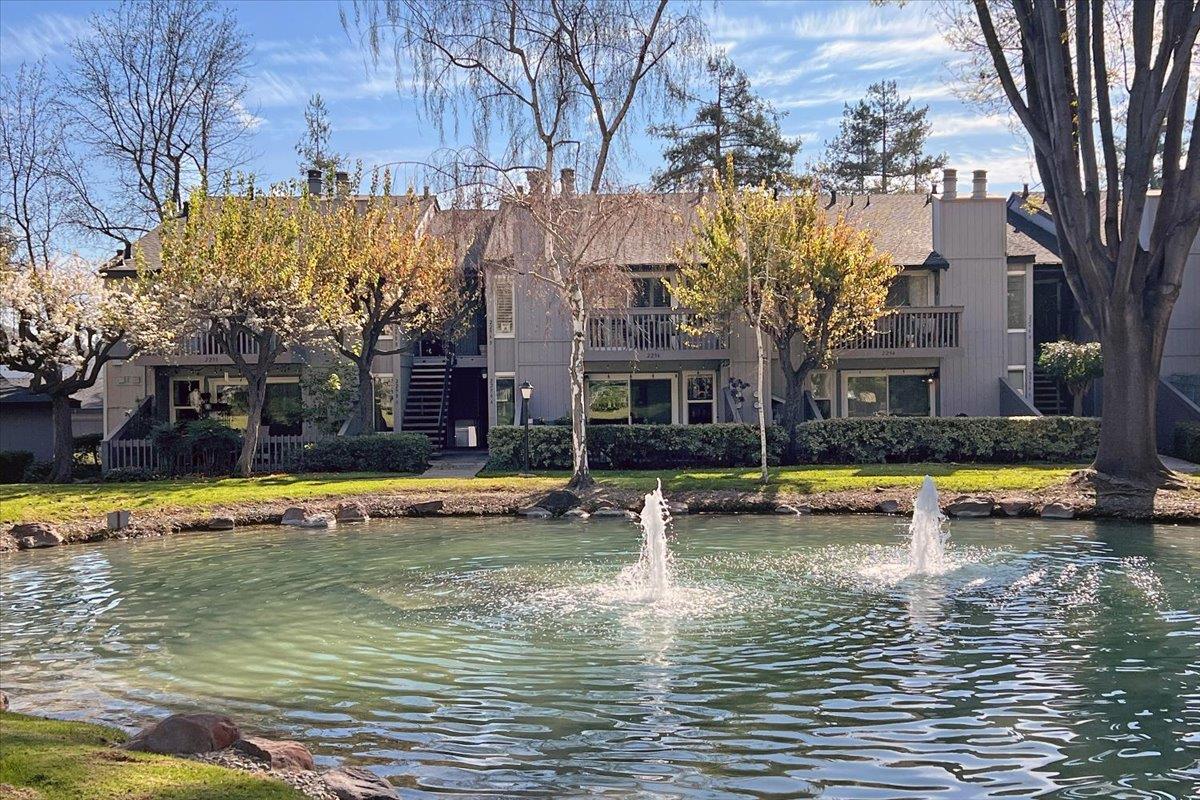 a view of a swimming pool with a house