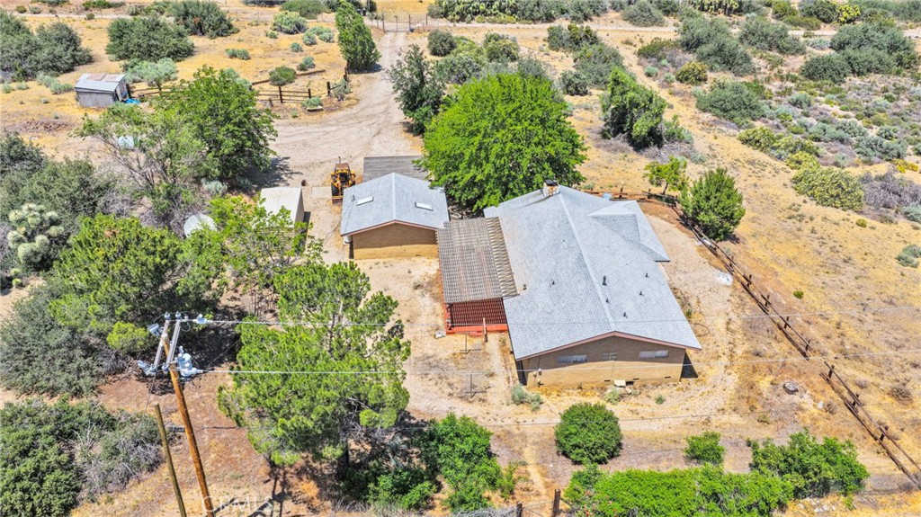 5500 Oil Well Road Phelan, CA 92371 - Photo 64 of 65 an aerial view of a house with a yard and trees
