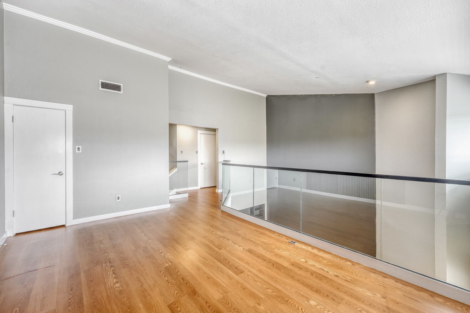 8200 Neely Drive, Unit 214 Austin, TX 78759 - Photo 12 of 19 a view of empty room with wooden floor