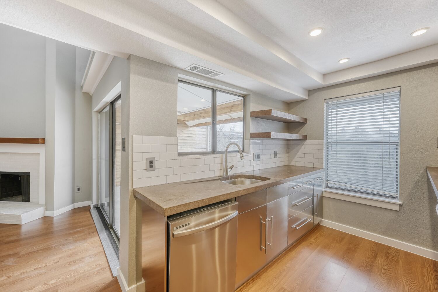 8200 Neely Drive, Unit 214 Austin, TX 78759 - Photo 5 of 19 a kitchen with a sink stove and cabinets