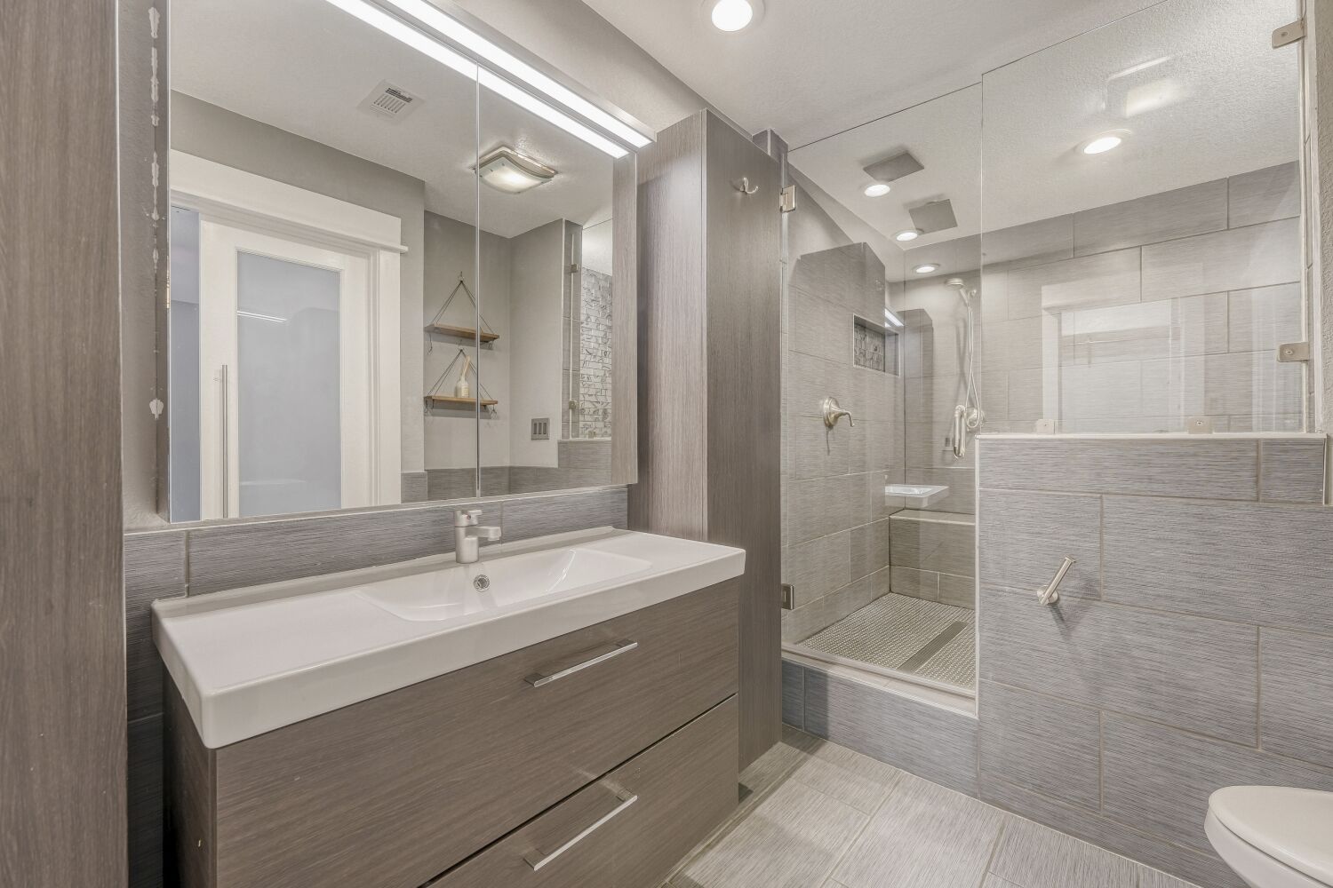 8200 Neely Drive, Unit 214 Austin, TX 78759 - Photo 9 of 19 a bathroom with a sink a toilet and shower