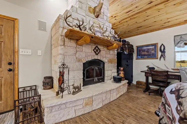 a view of a livingroom with furniture and a fireplace