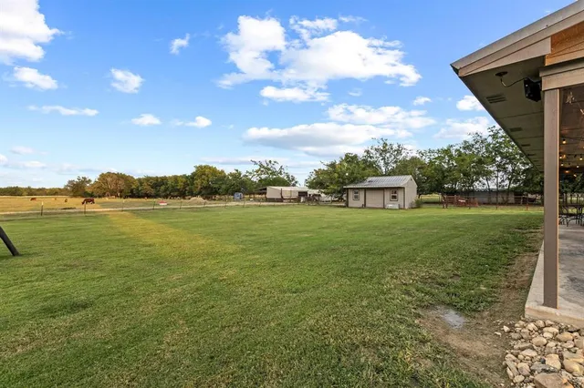 a view of a lake with a big yard