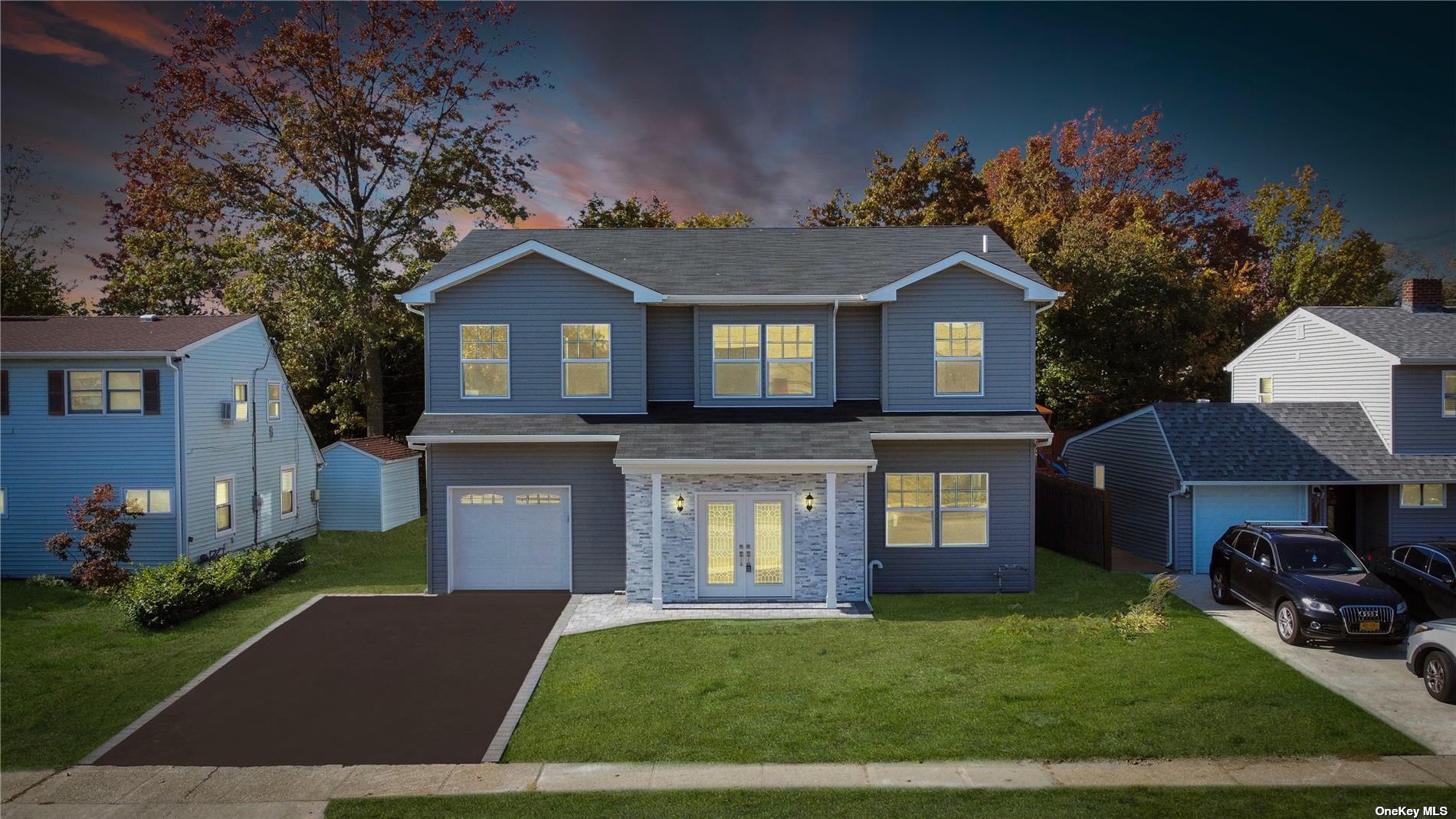 124 Hamlet Road Levittown, NY 11756 - Photo 1 of 1 a front view of a house with garden
