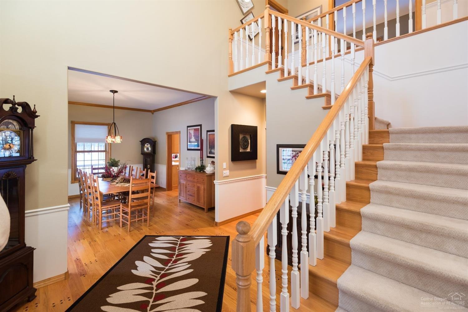 16190 Foothill Loop Sisters, OR 97759 - Photo 3 of 25 Formal Entry with Spindle Staircase and