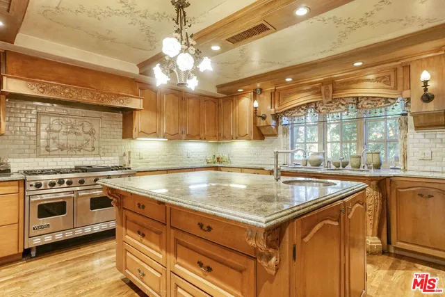 a kitchen with a stove and a sink