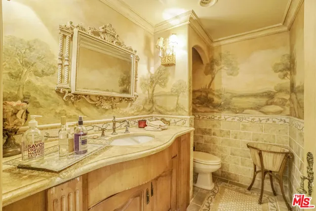 a bathroom with a sink mirror toilet and shower